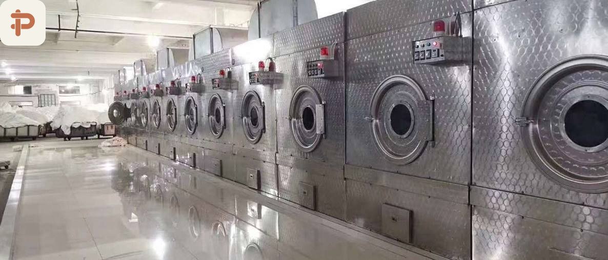 Row of stainless dyeing and washing machines at the plush mill
